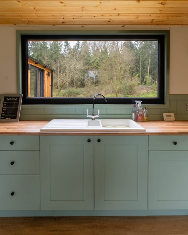 Kitchen looking out across the forest