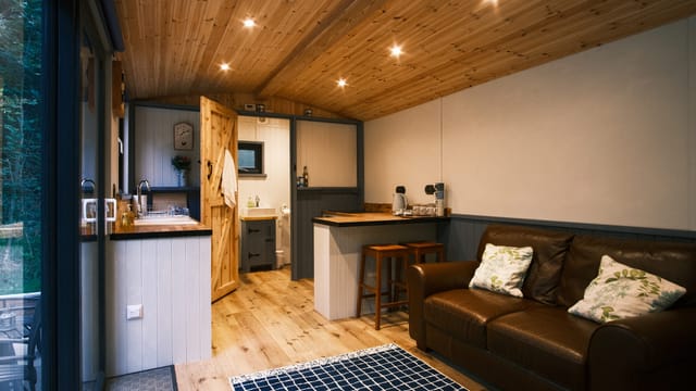 Hut interior with sofa and bed
