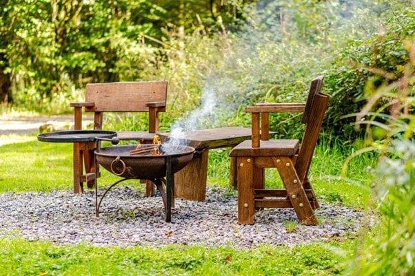 Fire pit and chairs in the woodland