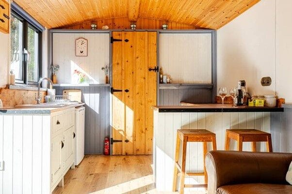 Hut kitchen with bar stools